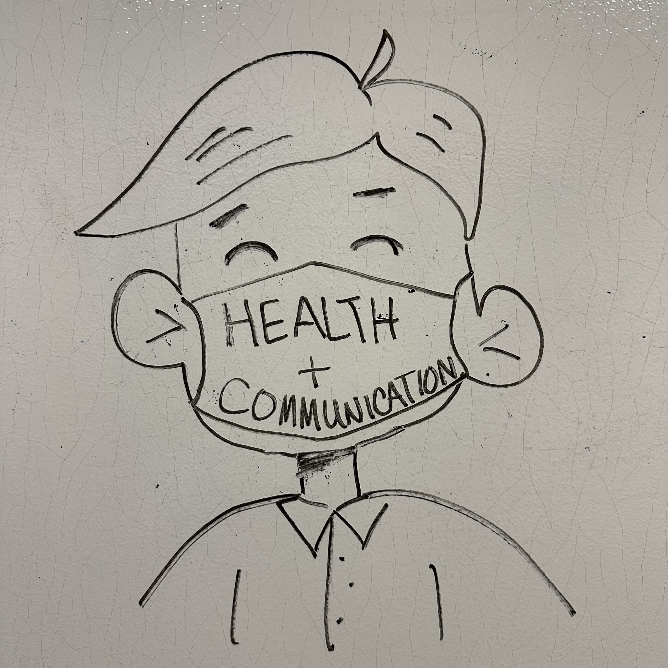 graphic of "health communication" written on a mask