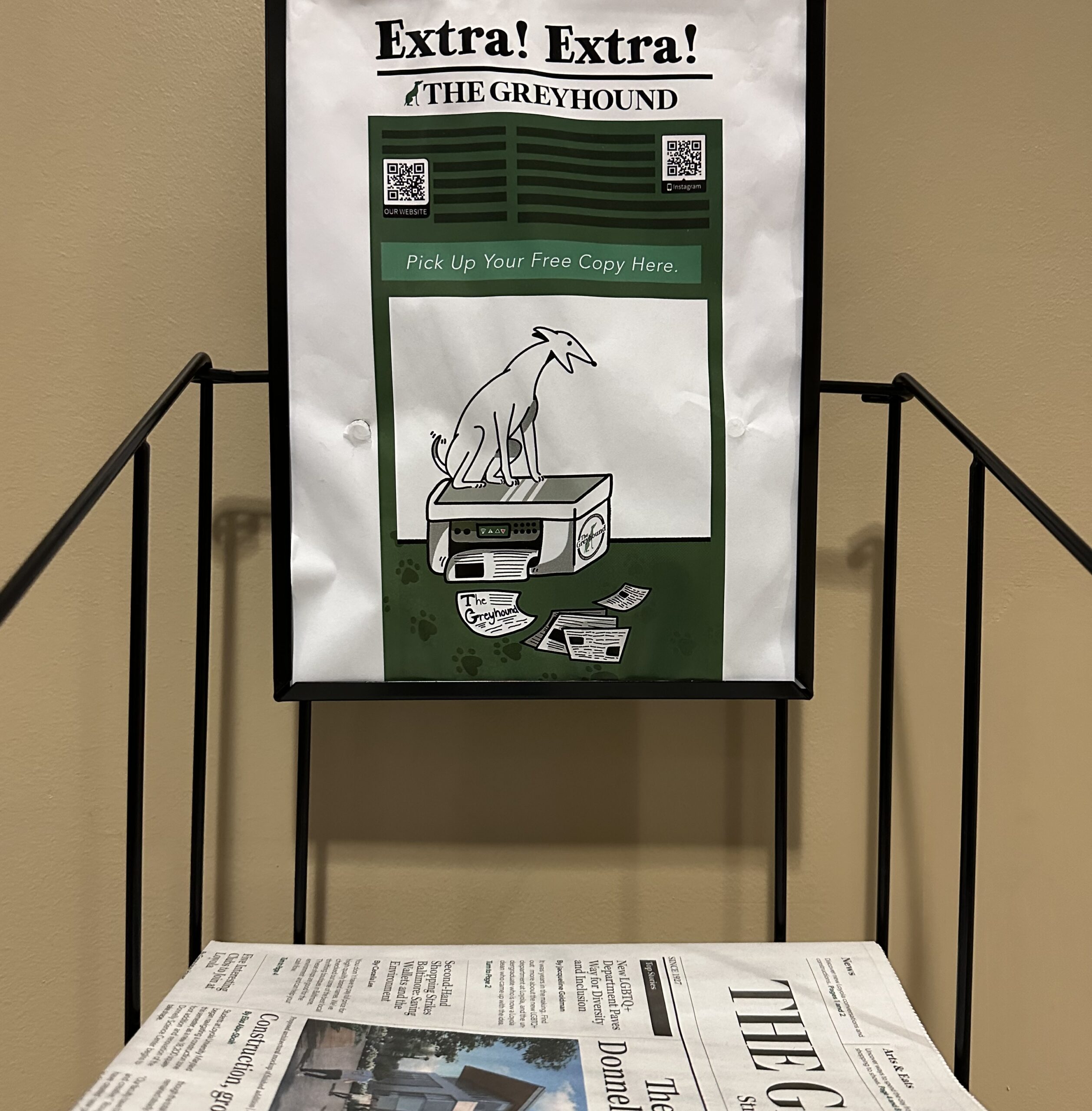 newspaper stand with poster of "the greyhound"